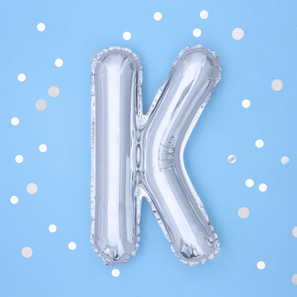Balon foliowy litera K srebrny pusty 35cm